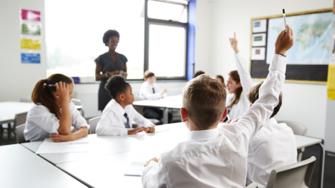 Generic pupils with teacher in classroom