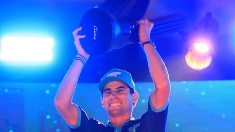 Joaquin Niemann celebrates with the trophy after winning the LIV Golf Mexico