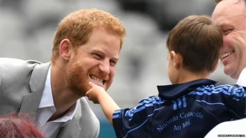 Prince Harry has his beard stroked