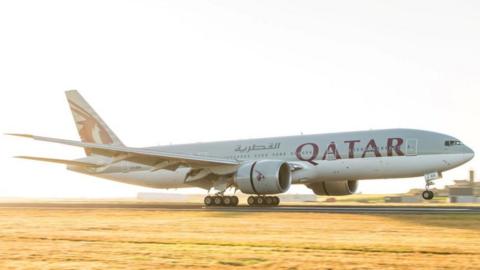 A Qatar Airways jet on a runway