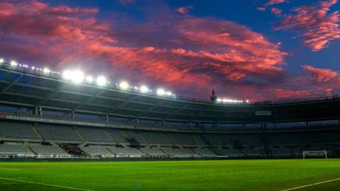 Clouds over a football stadium