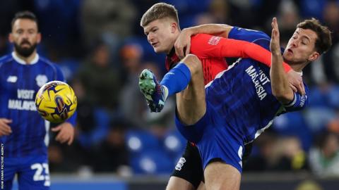 Ryan Wintle (right) of Cardiff challenges Jordan James of Birmingham