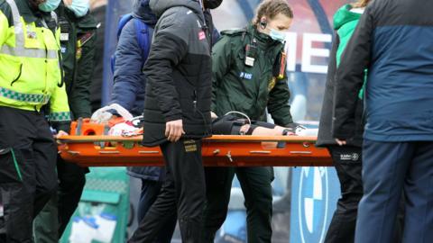 Sunderland midfielder Corry Evans is carried off on a stretcher