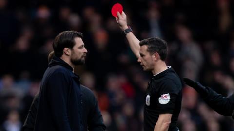 Russell Martin is shown the red card