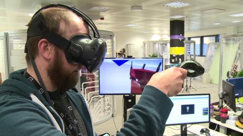 Improbable employee wearing virtual reality set