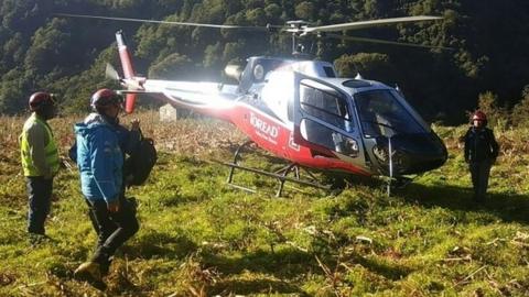 A rescue helicopter joins the search for the climbers in Nepal