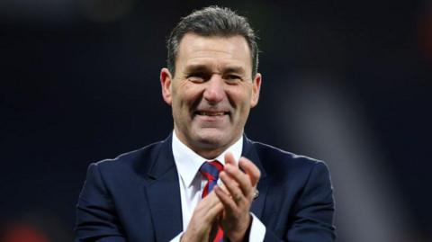 Aldershot Town manager Tommy Widdrington