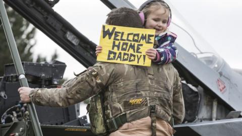 Pilot taking child into Tornado cockpit