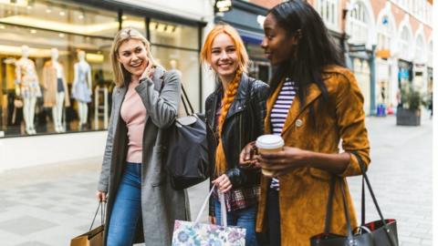 Three women shopping