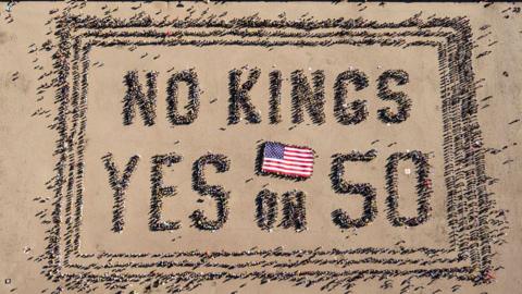 Aerial picture shows protesters forming a human banner during the No Kings rally in San Francisco, California on 18 October 2025 