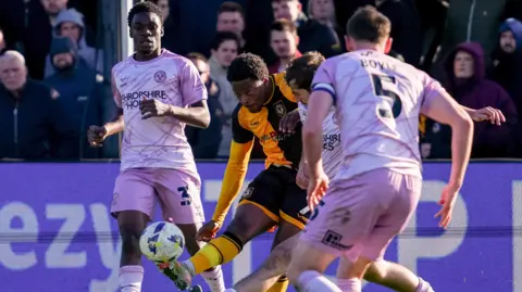 Bobby Kamwa in action for Newport