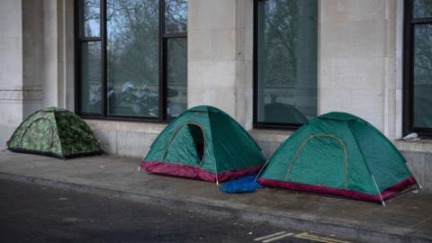 Three tents on the streets of London