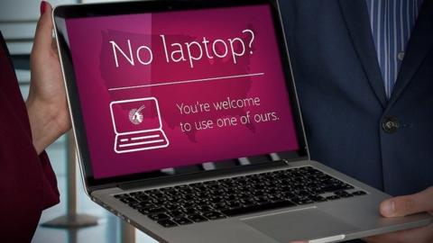 Banners shows laptop loan service by Qatar Airways