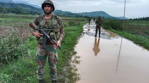 Indian Army officials patrol in the violence-hit area in India's north-eastern Manipur state on June 16, 2023. (
