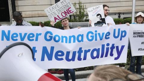 Protesters in Washington, with pro-net neutrality banners