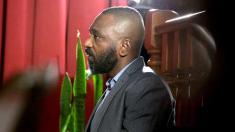 Jose Filomeno dos Santos (L), the son of former Angolan President Jose Eduardo dos Santos, appears in the high court on corruption charges in Luanda, on December 9, 2019