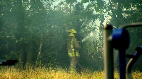 Firefighters battled 500 acres of gorse alight behind a school