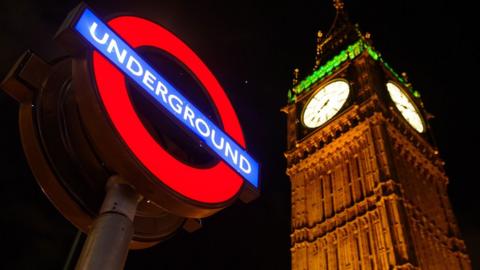 London Underground roundel next to Big Ben