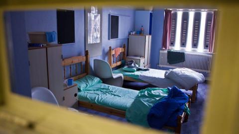 A view through the cell door to the the rooms shortly before the prison was closed