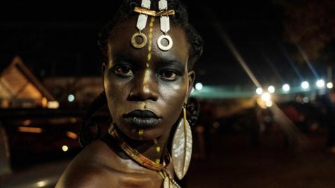 A model poses backstage before Burundi's Margaux Wong collection during the 6th Kampala Fashion Week, the annual showcase of fashion brands from East Africa, in Kampala, Uganda, on September 28, 2019.