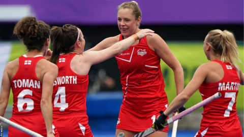 England's players celebrate scoring against India