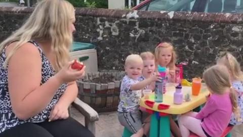 Children at nursery with teacher