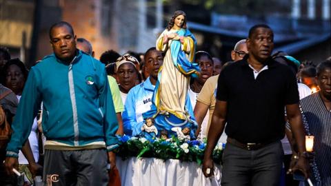 People in Guapi carry a statue of the Virgin Mary as part of the balsadas festivities