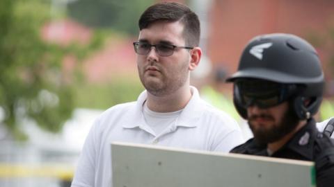 James Alex Fields Jr., (L) is seen attending the "Unite the Right" rally in Emancipation Park before being arrested by police