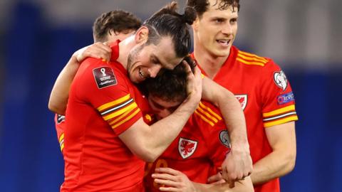 Gareth Bale helps Daniel James celebrate his winning goal