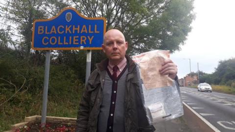 Police officer with found cash