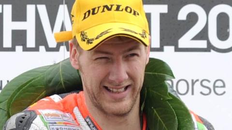 Ian Hutchinson celebrates winning at the North West 200