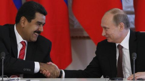 Russia's President Vladimir Putin (R) and his Venezuelan counterpart Nicolas Maduro shakes hands during a signing ceremony at the Kremlin in Moscow, on July 2, 2013