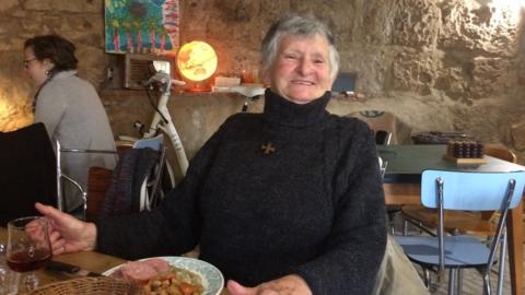 Pensioner Genevieve enjoys her birthday lunch in the Veloc café in Perigueux, south-west France