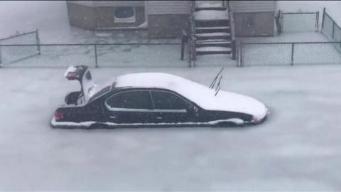 Sub-zero temperatures and extreme floods in Revere, USA, trapped dozens of cars in ice.