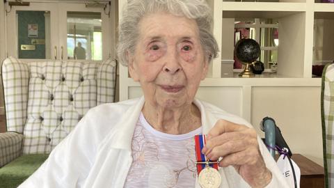 Evelyn Hillier with medal