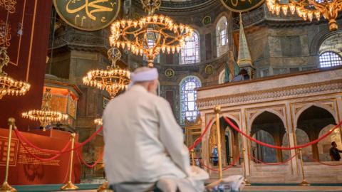 A worshipper prays during the first Muslim prayers in Hagia Sophia, in Istanbul, on July 24, 2020