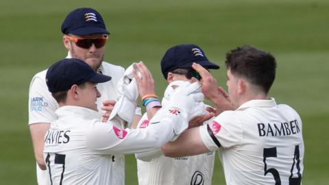 Middlesex players celebrate first wicket of 2024