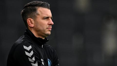 Wycombe manager Matt Bloomfield watches his team from the touchline