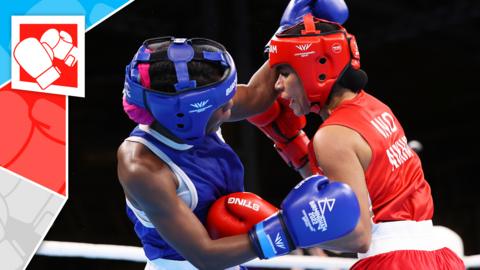 Two boxers compete