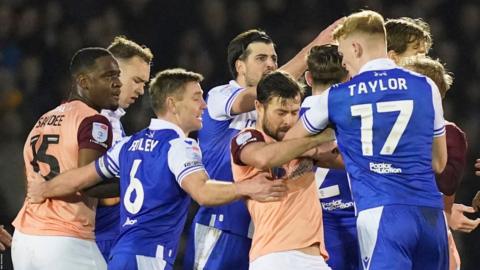 Bristol Rovers and Portsmouth players shoving