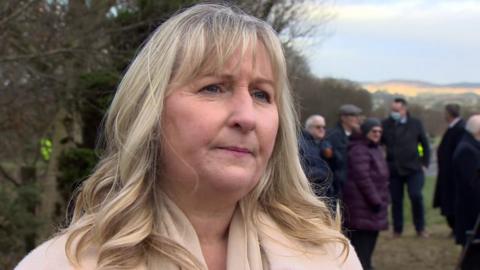 Survivors and victims' relatives mark the 30th anniversary of the IRA bomb attack at Teebane, County Tyrone.