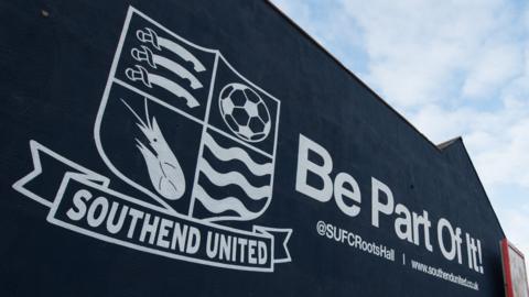 The logo of Southend United on the side of a building in the town