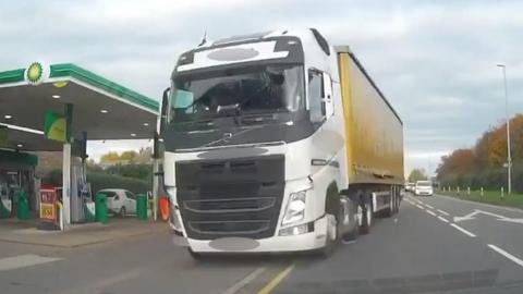 Lorry careering across a road