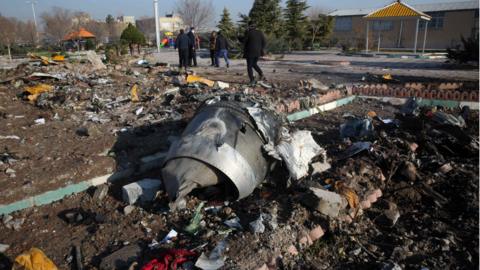 Recovery teams work amid wreckage after a Ukrainian plane crashed in Tehran on 8 January, 2020.