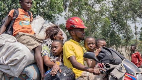 A family flees fighting towards Goma, DR Congo - February 2024