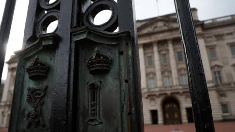 File image showing the lock to the main gates at Buckingham Palace