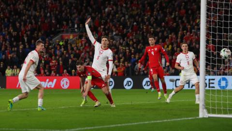Wales captain Ben Davies sees his goal disallowed