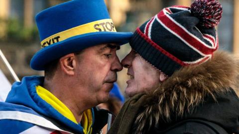 Anti-Brexit protester Steve Bray (L) and a pro-Brexit protester argue as they demonstrate outside the Houses of Parliament in Westminster