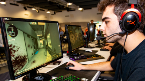 Staffordshire University student playing esports on a computer