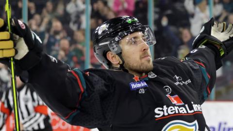 Belfast's Scott Conway celebrates scoring a penalty in the shootout win